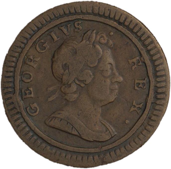 Pièce de cuivre montrant le profil d’un roi portant une couronne de laurier dans les cheveux.