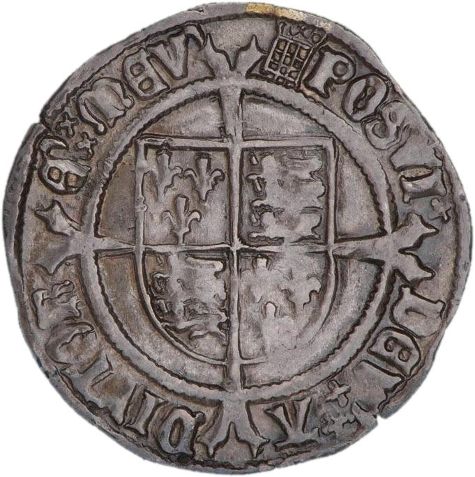 Pièce d’argent frappée grossièrement montrant une croix sur un bouclier.