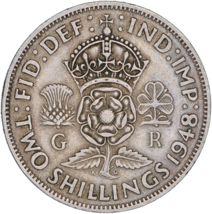 Pièce d’argent sur laquelle figure une couronne surmontant une rose anglaise, un chardon écossais et un trèfle irlandais.