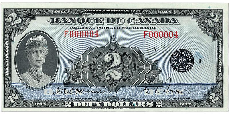 Billet de banque bleu, motifs géométriques complexes, femme à l’air sévère portant une couronne et un haut ras-de-cou serti de pierres précieuses : la reine Marie.