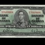 Billet de banque vert, tronqué, motifs géométriques complexes, jeune homme en uniforme militaire d’époque : le roi George VI.