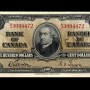 Billet de banque brun, motifs géométriques complexes, homme portant un col montant et un manteau à col de fourrure : sir John A. Macdonald.
