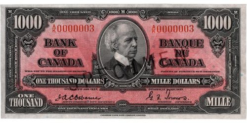 Billet de banque rose, motifs géométriques complexes, homme chauve portant un habit à col montant d’époque : sir Wilfrid Laurier.