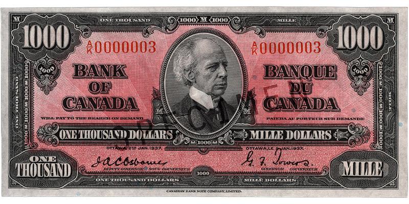 Billet de banque de 1 000 dollars Billet de banque rose, motifs géométriques complexes, homme chauve portant un habit à col montant d’époque : sir Wilfrid Laurier.