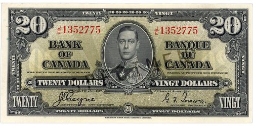 Billet de banque vert pâle, motifs géométriques complexes, jeune homme en uniforme militaire d’époque : le roi George VI.