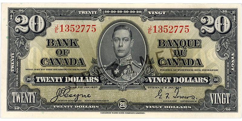 Billet de banque vert pâle, motifs géométriques complexes, jeune homme en uniforme militaire d’époque : le roi George VI.