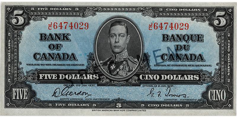 Billet de banque de 5 dollars Billet de banque bleu, motifs géométriques complexes, jeune homme en uniforme militaire d’époque : le roi George VI.