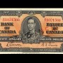 Billet de banque orange, motifs géométriques complexes, jeune homme en uniforme militaire d’époque : le roi George VI.