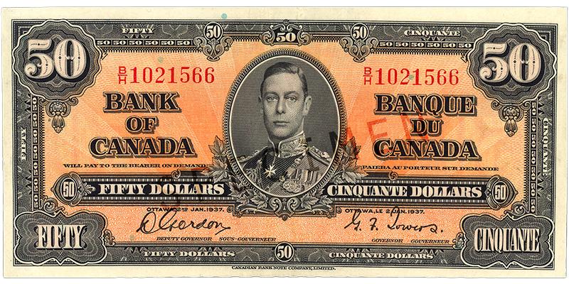 Billet de banque orange, motifs géométriques complexes, jeune homme en uniforme militaire d’époque : le roi George VI.