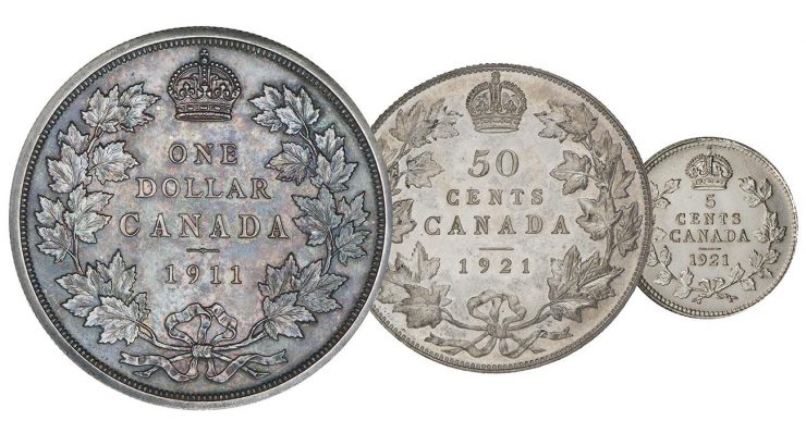 Trois pièces d’argent de différentes tailles dont la bordure est ornée d’une couronne de feuilles d’érable.