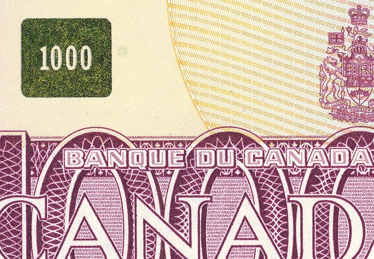 Gros plan d’un billet de banque comportant un carré doré dans lequel figure le nombre 1 000.