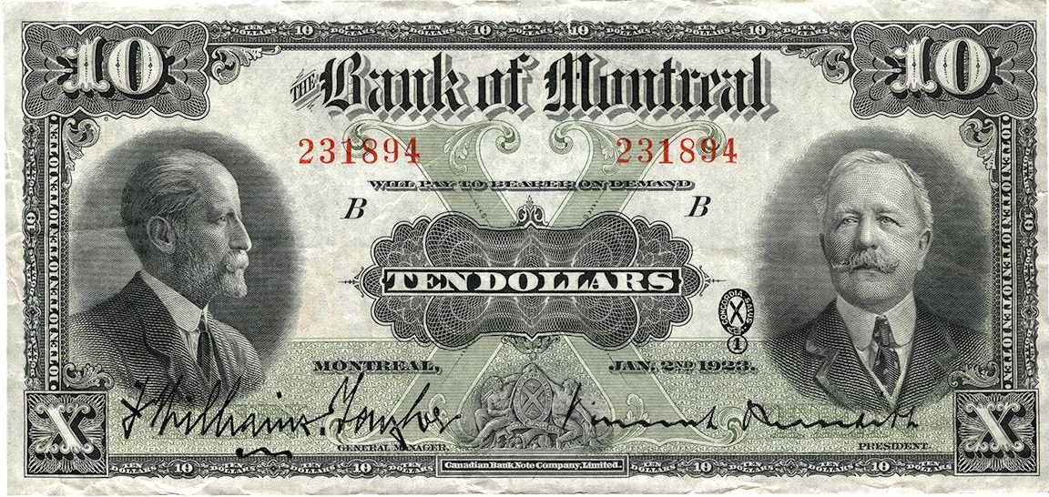 Billet de banque vert orné des portraits de deux hommes d’affaires moustachus portant un col montant.