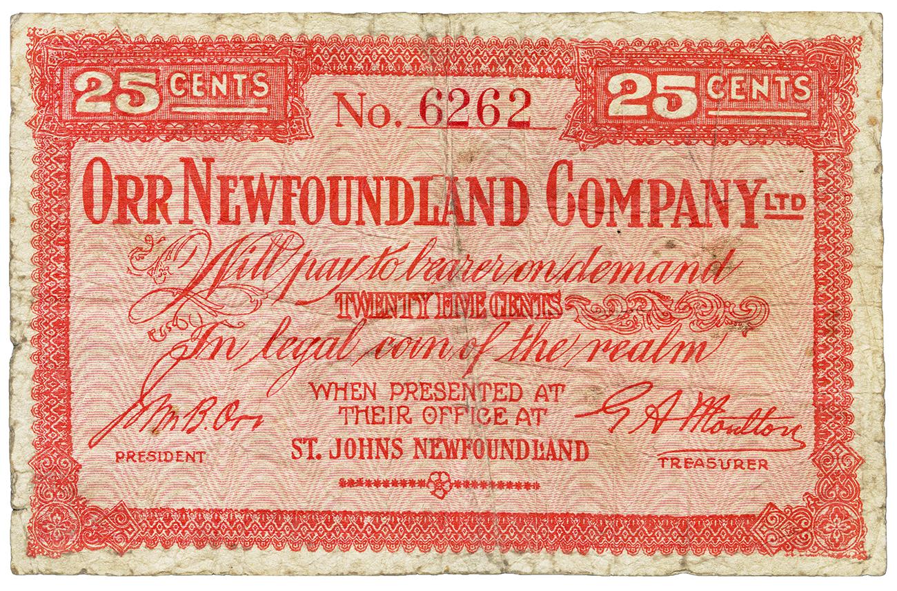 Papier-monnaie rouge, cadre à motifs géométriques, écritures imprimées. 