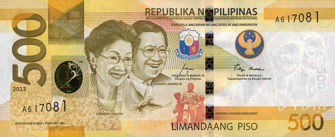 Billet de banque jaune orné du portrait côte à côte d’une femme et d’un homme qui sourient et portant tous deux une tenue officielle et des lunettes.