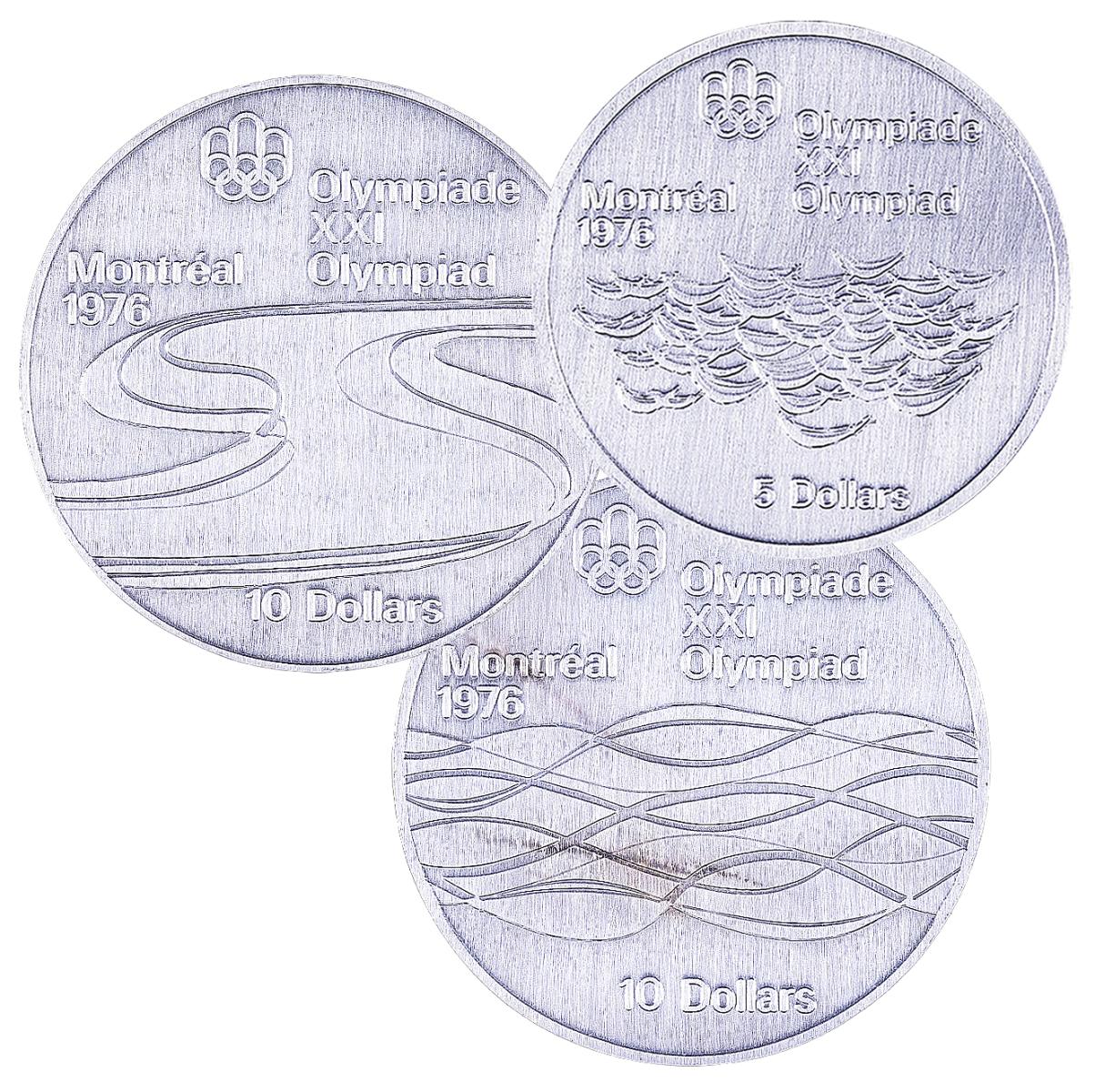 Trois pièces d’essai pour la série 5 des pièces des Jeux olympiques : disciplines nautiques Trois pièces d’argent ornées de lignes ondulées, d’anneaux entrelacés et de l’inscription Montréal 1976.