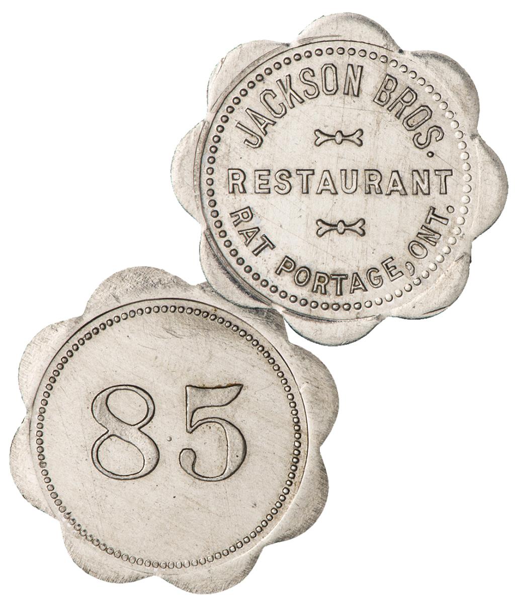 Jeton de restaurant Jeton argenté au pourtour orné de 8 demi-cercles rappelant une fleur, le chiffre 85 inscrit au revers.