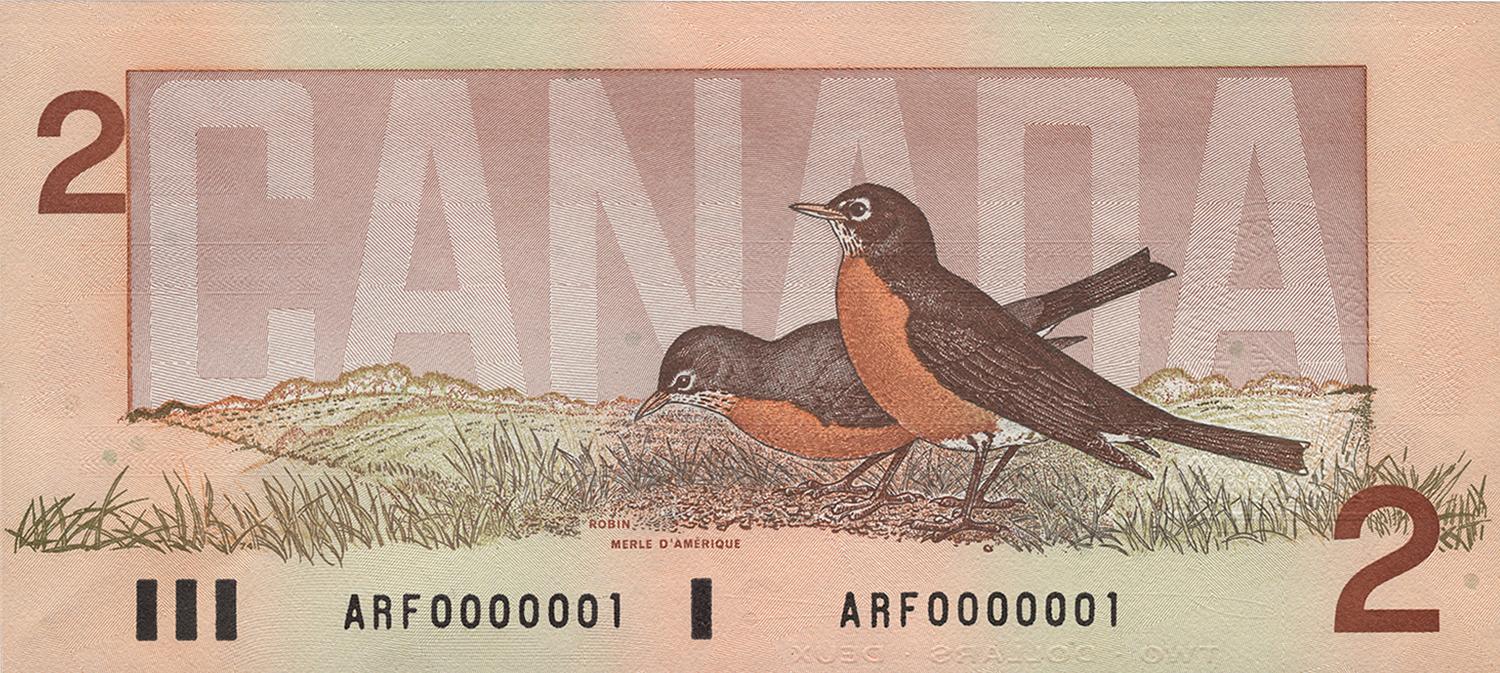 Le verso du billet de 2 dollars de 1986 représentant deux rouges-gorges.